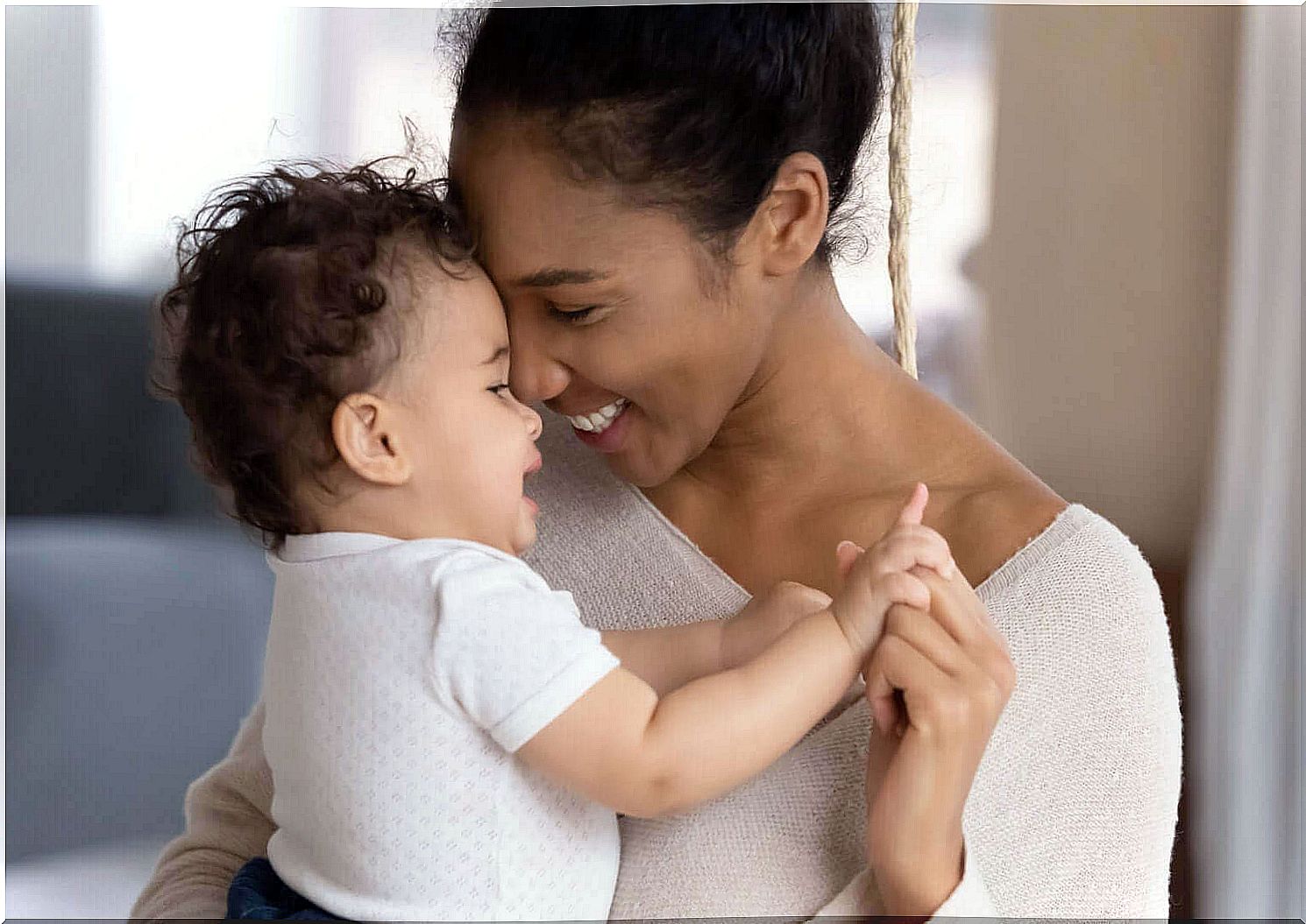 Baby is happy in mommy's arms