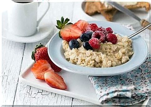 A healthy breakfast of oats with fruit on top