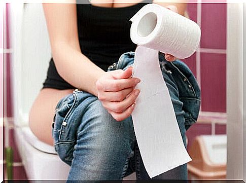 Girl sitting on the toilet and having white stools