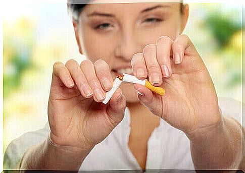 woman breaks a cigarette